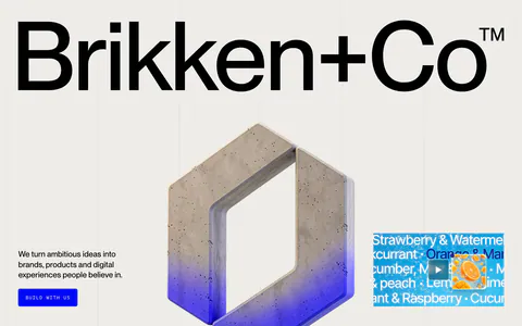 Brikken+Co hero section: giant wordmark above a 3D concrete hexagon logo, short copy with blue button and video thumbnail