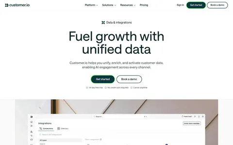 Customer.io hero section: centered headline and buttons above an integrations directory screenshot on an office photo, with a logo row