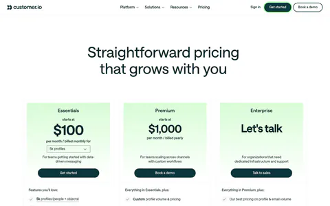 Customer.io pricing section: nav and centered headline above three plan cards with mint-tinted headers, prices, buttons and checklists