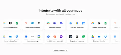 Fillout integrations section: centered heading above two rows of cards grouping app icons by task, cut off at the edges, and a view-all button