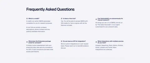 Godmode FAQ section: left-aligned heading above a three-column grid of question and answer pairs on a pale gray background