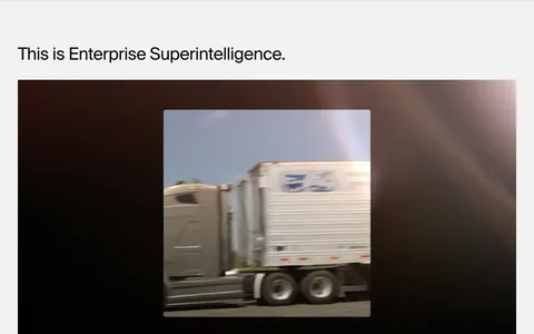 HappyRobot features section: left-aligned headline above a wide dark video player showing footage of a moving truck, on light gray