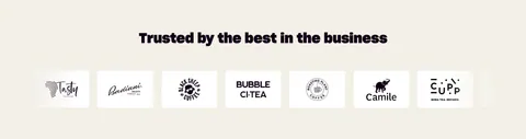 Nory logo cloud section: centered headline above a row of restaurant brand logos in white cards on a cream background