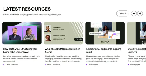 Semrush blog & resources section: headline with View all and arrow buttons above a carousel of webinar and whitepaper cards