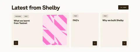 Shelby blog & resources section: headline with All news button above a wide featured post card with pink abstract art and two post cards