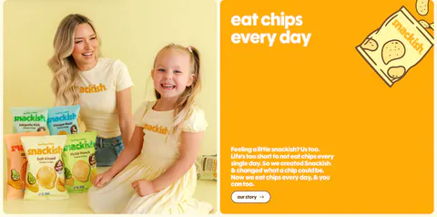 Snackish about & mission section: photo of a woman and girl with chip bags beside an orange panel with headline, story copy and button
